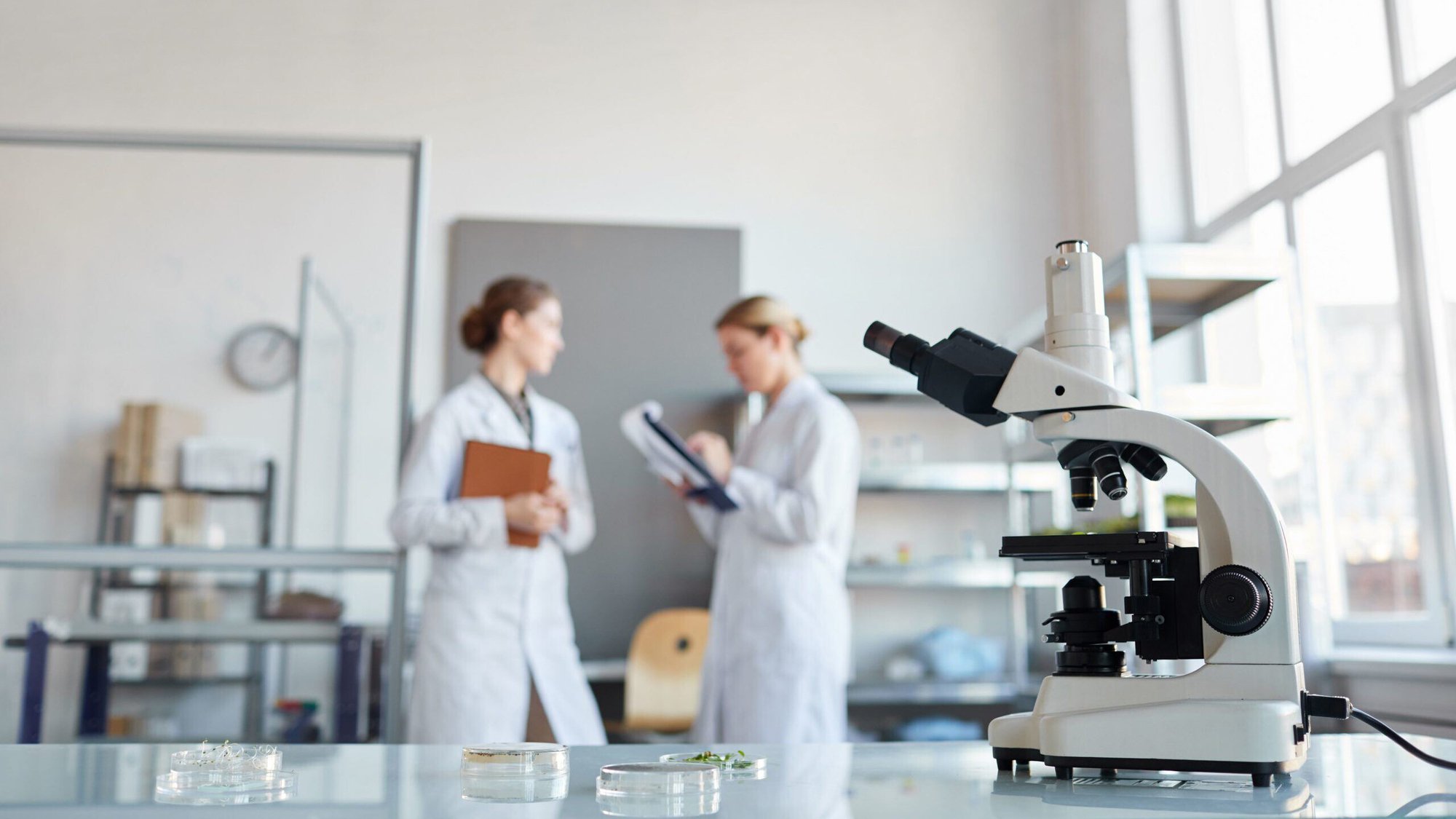 16x9_Medical Two Women Microscope