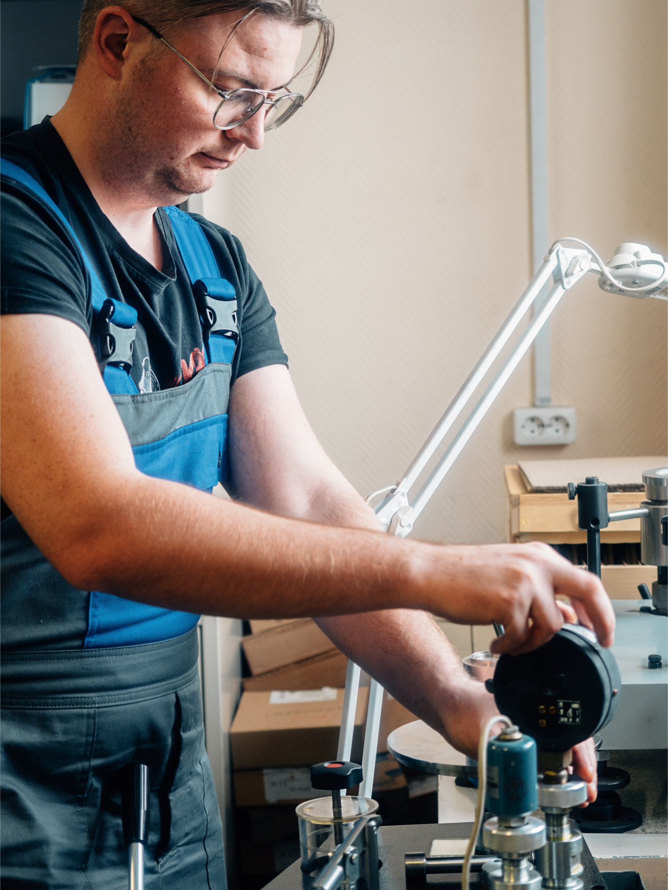 technician adjusting metrology equipment